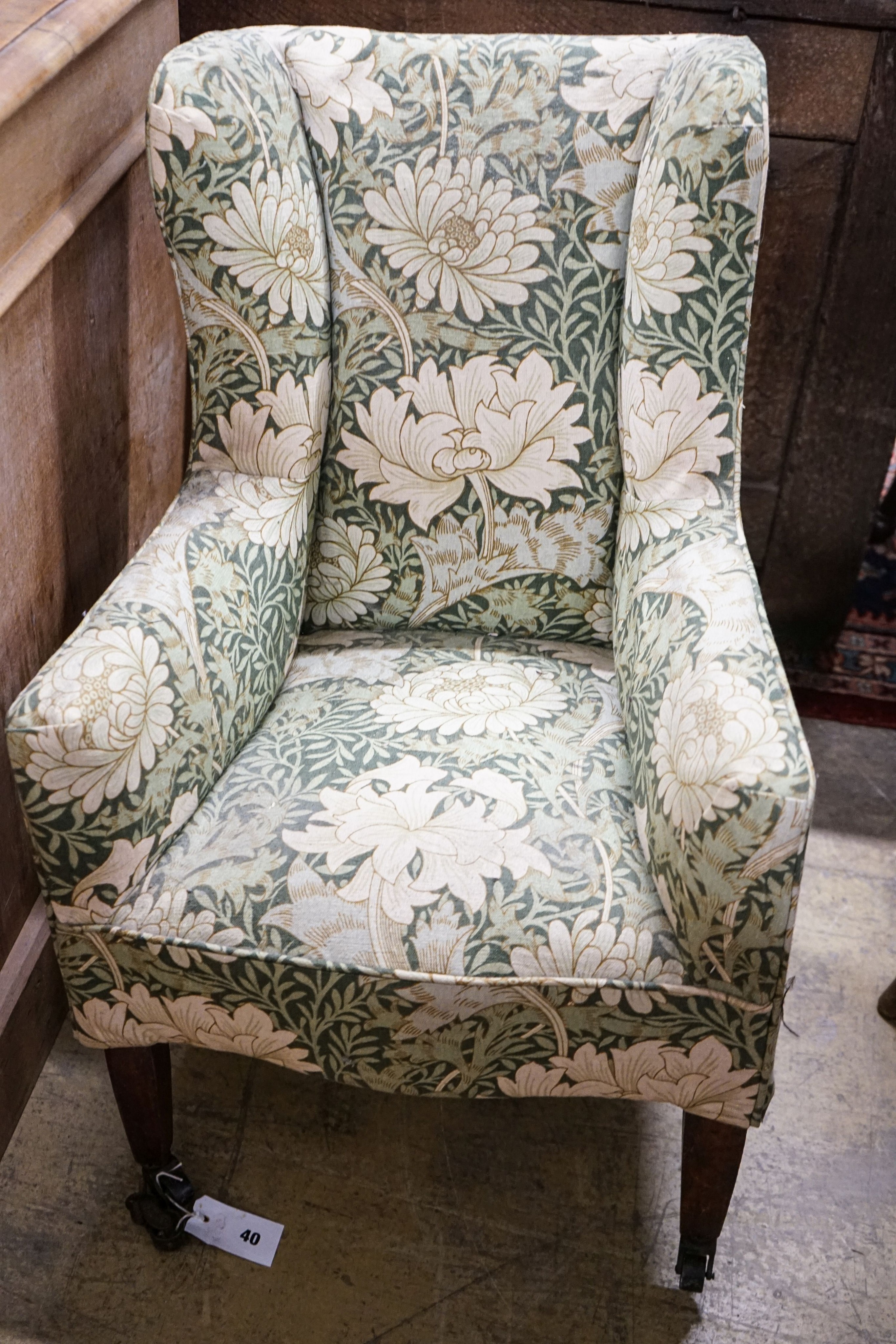 A George III mahogany child's armchair, with square tapered legs fitted brass castors, width 49cm, depth 48cm, height 78cm